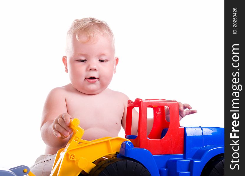 Little boy  with a big car on white background