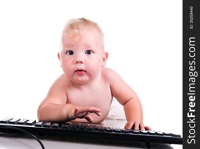 Little child holding keyboard isolated over white
