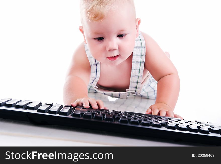 Little child holding keyboard isolated over white