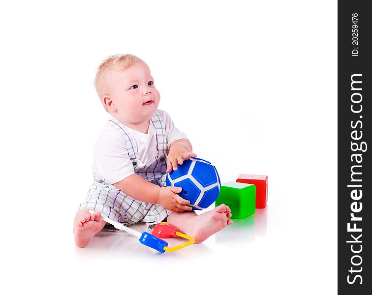 Little boy with a toys on white background