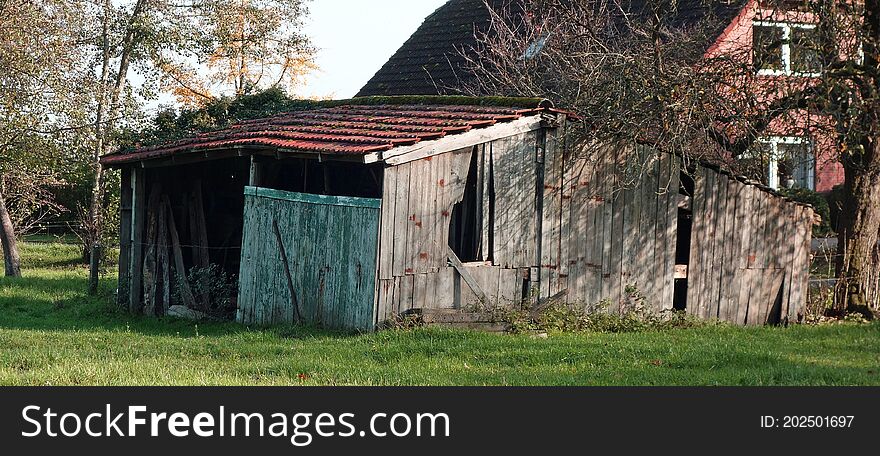 Old Shed Before A House.