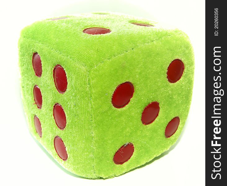 Green dice on a white background with red dots. Green dice on a white background with red dots