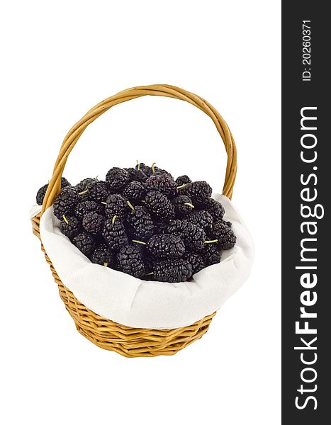 Mulberrys in a wooden basket, isolated on white. Mulberrys in a wooden basket, isolated on white.