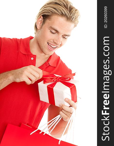 Young man opening a gift. Young man opening a gift