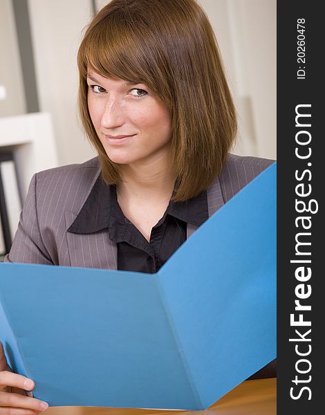 Woman Reading Application File