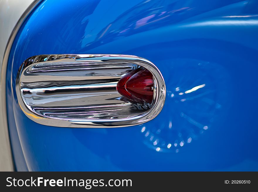 Car light detail of an old car with border chrome