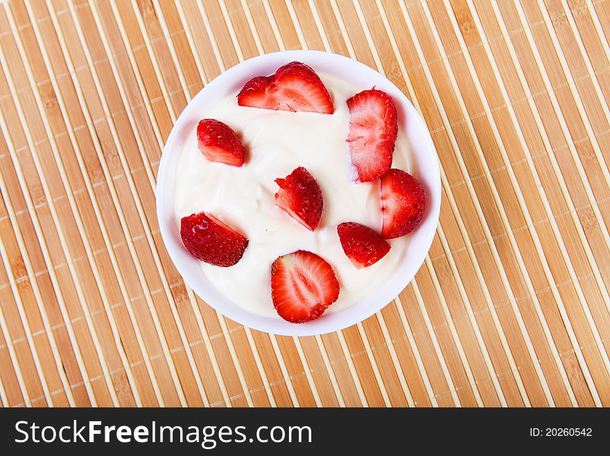 Early breakfast. Strawberries, cream and juice. The symbol of healthy lifestyles.