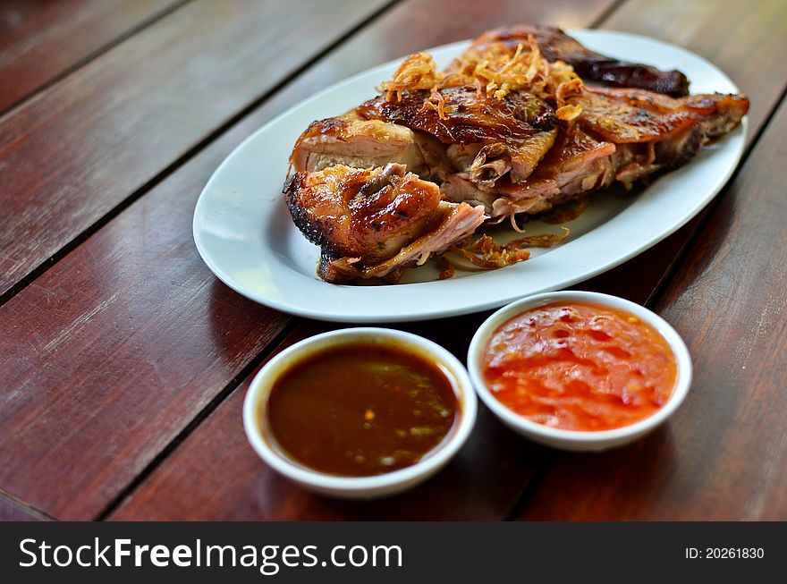 Grilled chicken with spicy sauce , Thai style food