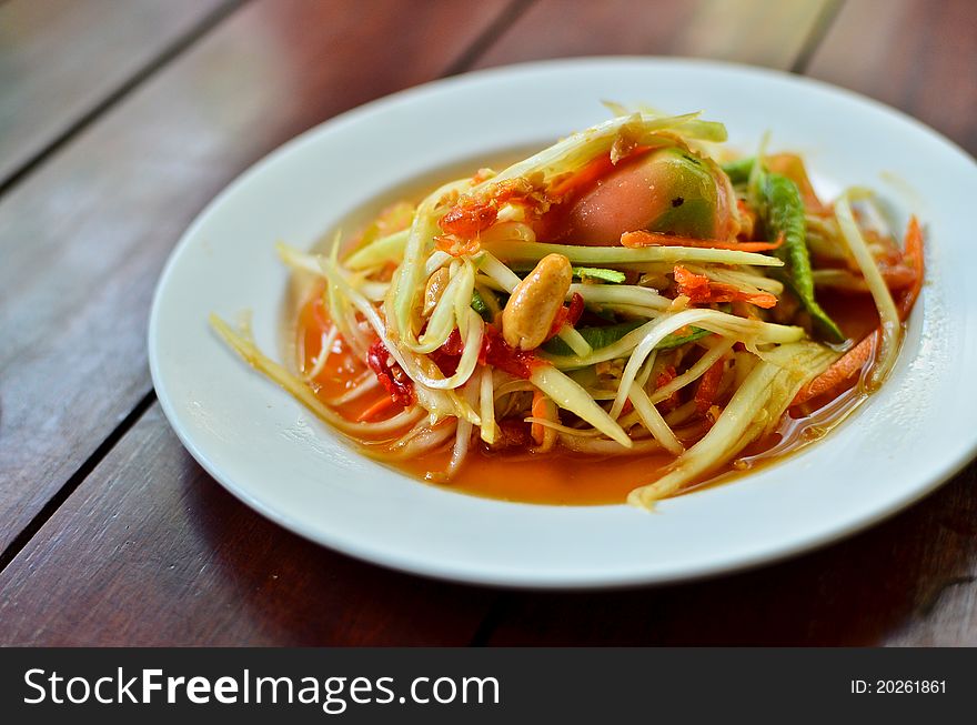 Thai papaya salad hot and spicy mixed from variety of vegetable closeup