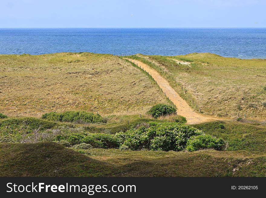 Sand dunes with road at sea. Sand dunes with road at sea