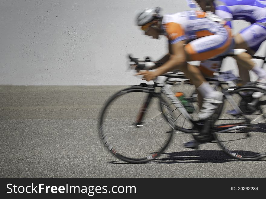 Blurred motion cyclists in a race. Blurred motion cyclists in a race