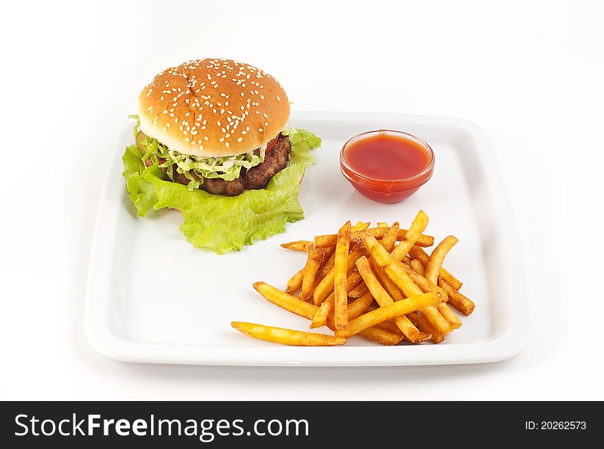 Hamburger with a potato on a white background close up. Hamburger with a potato on a white background close up