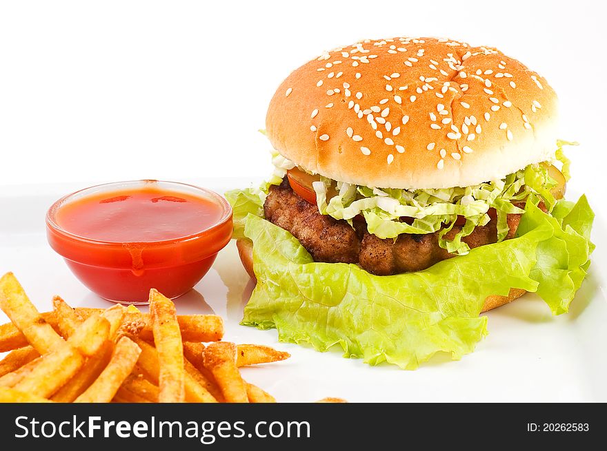 Hamburger with a potato on a white background close up. Hamburger with a potato on a white background close up