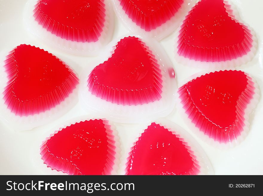 Red jelly on white background. Red jelly on white background.