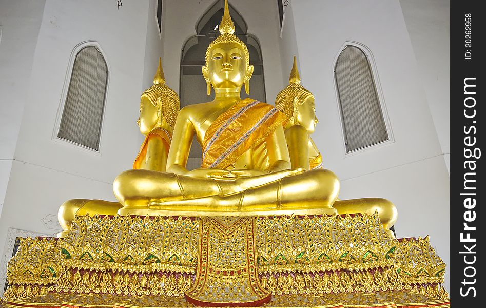 Statue of Buddha sit on the haunches in Thailand