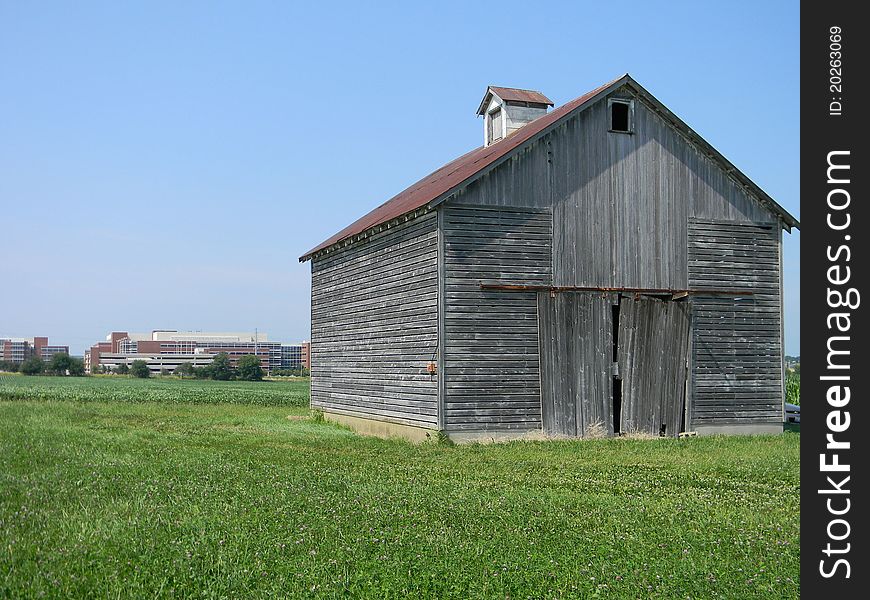 This old corn crib with the new building behind shows the encroachment of the new upon the old. The competition for the land.