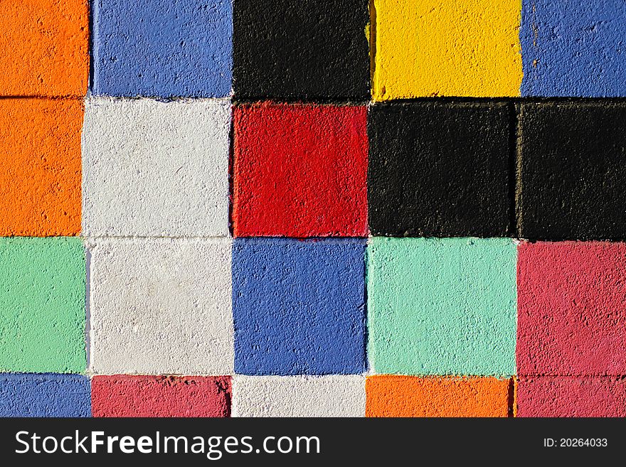 Detail of a painted tiled facade in vibrant colors. Detail of a painted tiled facade in vibrant colors