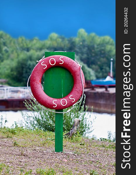 Red life preserver on the green column
