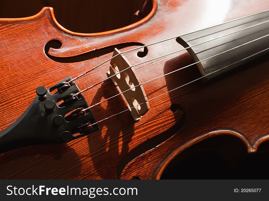 Close up of violin with dark background. Close up of violin with dark background