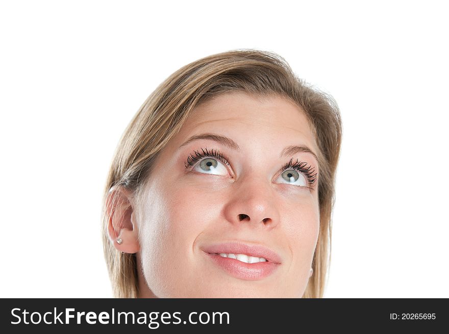 Happy smiling young girl looking up with thinking and aspiring expression isolated on white background. Happy smiling young girl looking up with thinking and aspiring expression isolated on white background