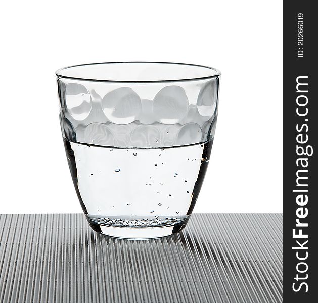 Water on a glass on white background