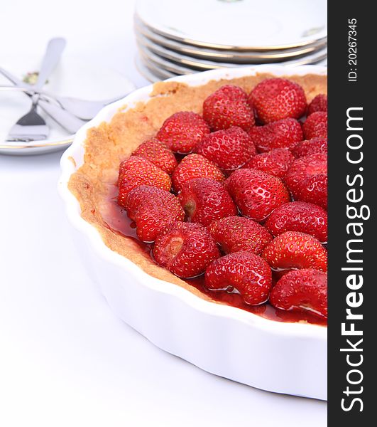 Strawberry Tart, plates and forks, on a white background