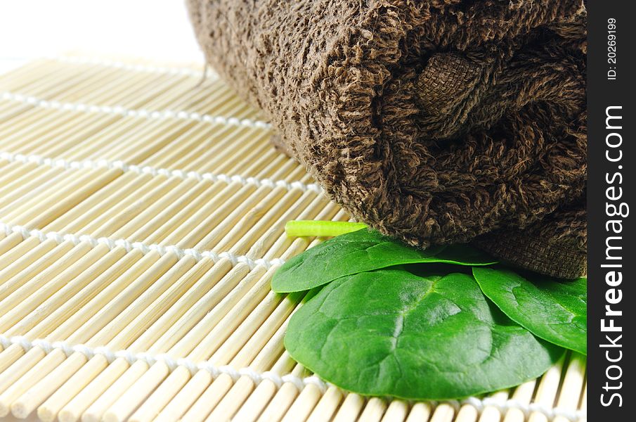 Spa towel with leaves closeup. Spa towel with leaves closeup