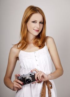 Girl In White Dress With Vintage Camera. Royalty Free Stock Photography