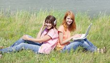 Girlfriends At Countryside With Laptop Royalty Free Stock Photography