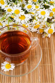 Glass Cup With A Camomile Tea Stock Photos Glass Cup With A Camomile Tea Stock Photos