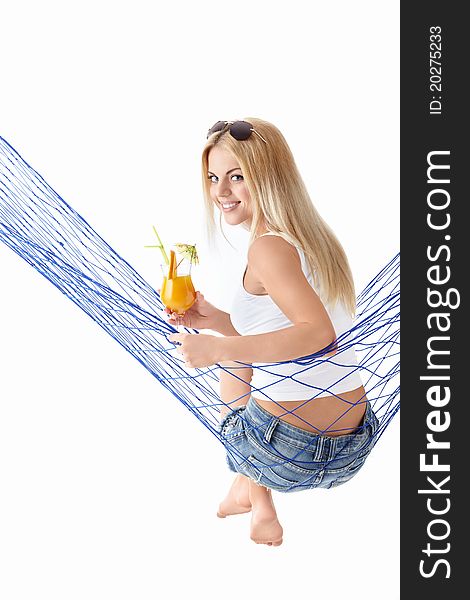 Attractive girl with a cocktail in a hammock isolated. Attractive girl with a cocktail in a hammock isolated