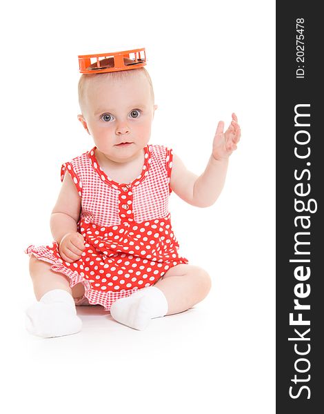 Baby in dress on a white background.