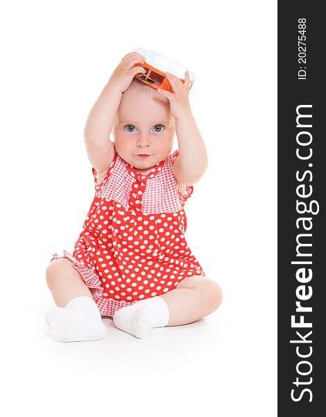 Baby in dress on a white background.