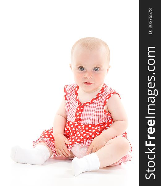 Baby in dress on a white background.