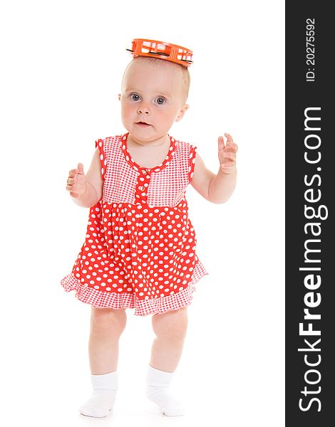 Baby in dress on a white background.