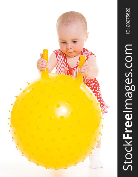 Baby in dress on a white background.