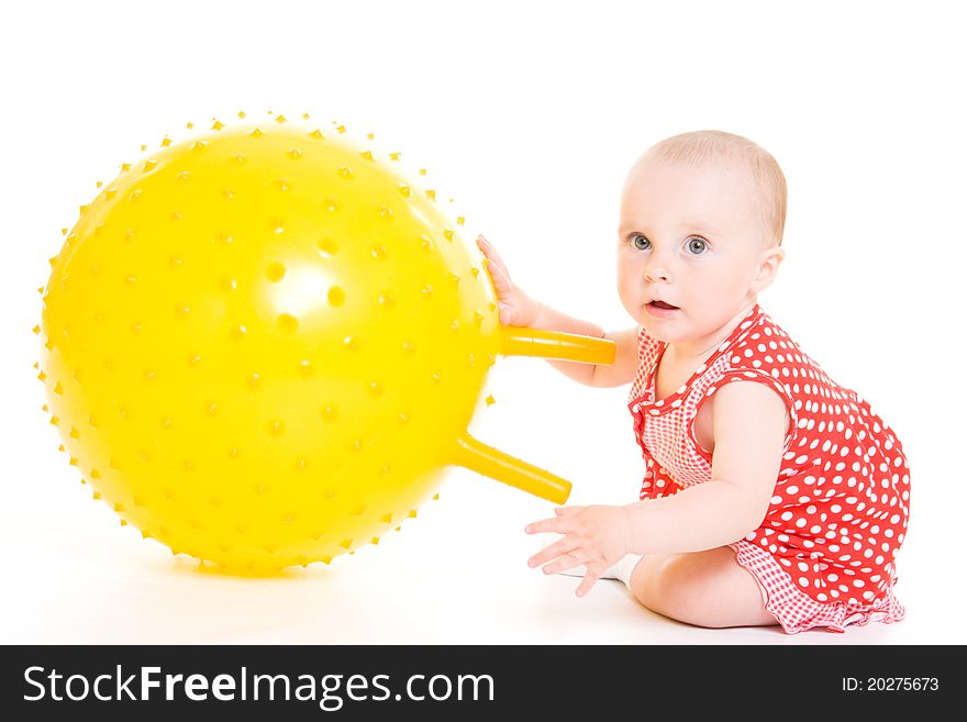 Baby in dress on a white background.