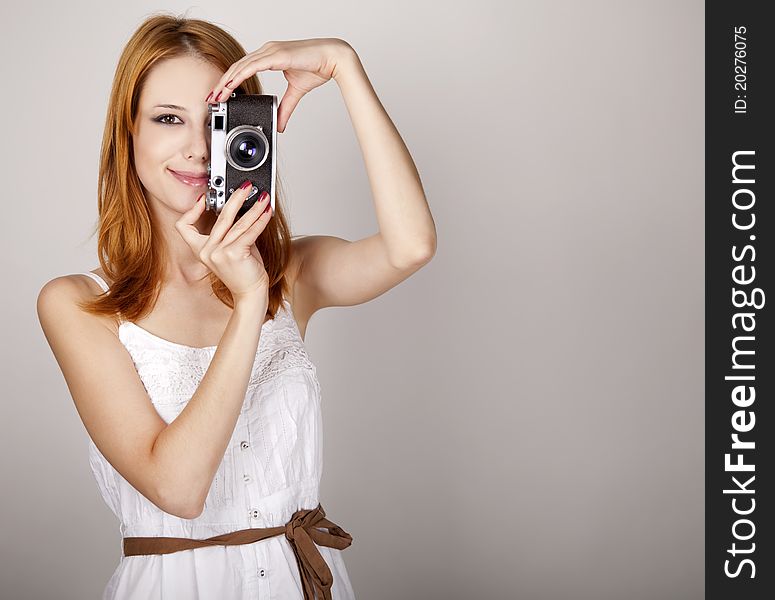 Girl In White Dress With Vintage Camera.