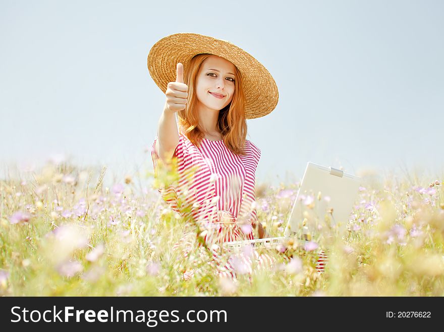 Retro style girl at countryside with notebook.