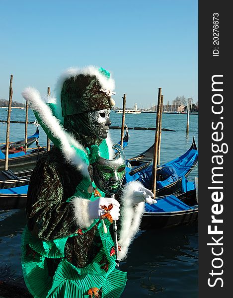 Green mask at Venice embankment during carnival 2011. Green mask at Venice embankment during carnival 2011