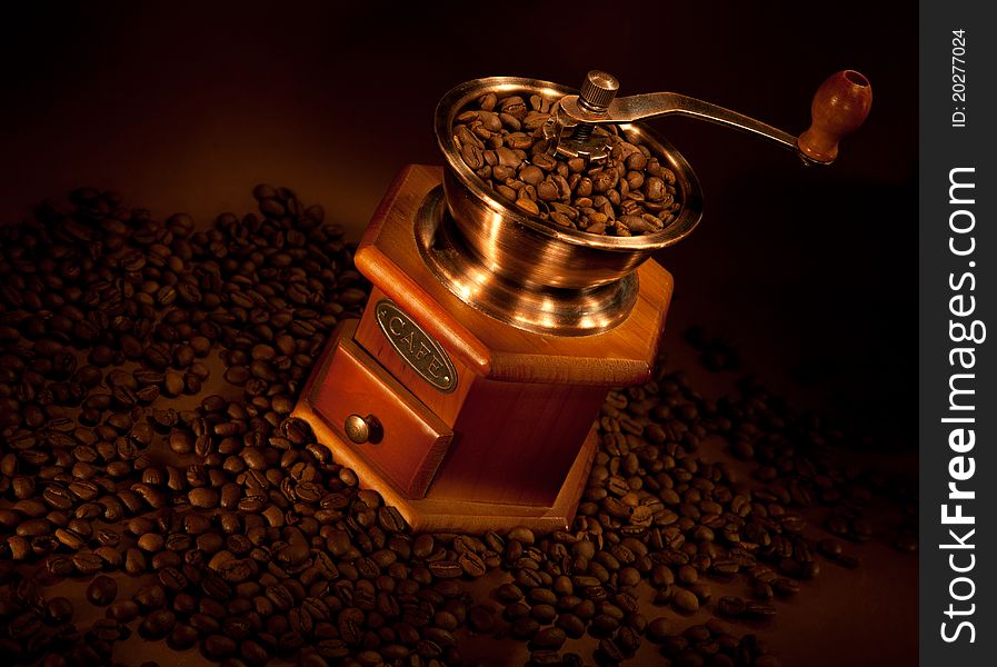 Coffee grinder with coffee beans. Coffee grinder with coffee beans.