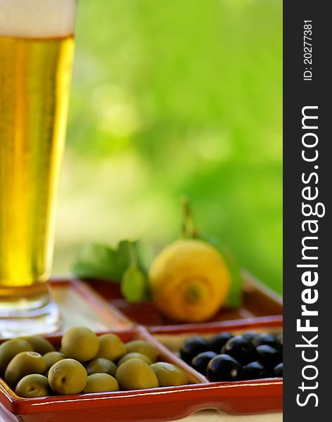 Beer glass with olives