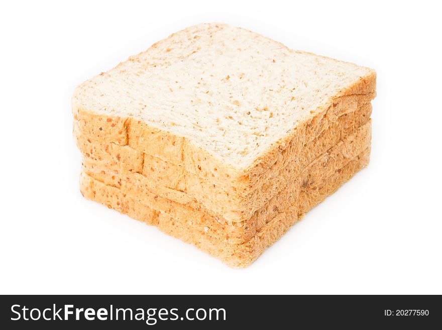 Stack of whole wheat bread on white background