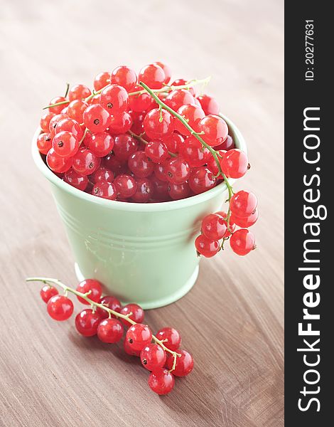 Fresh redcurrants in a bucket