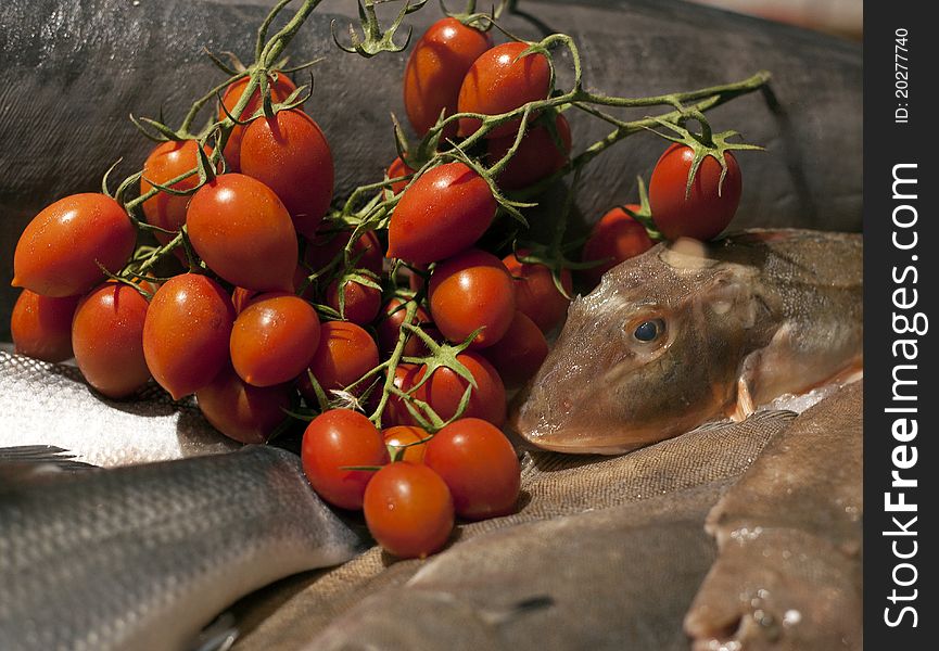 Cherry tomato, sole fish and a somni fish. Cherry tomato, sole fish and a somni fish