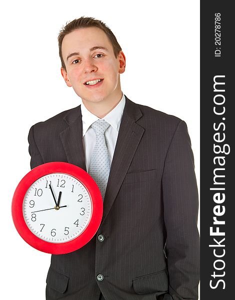 Young businessman holding a clock isolated on white background