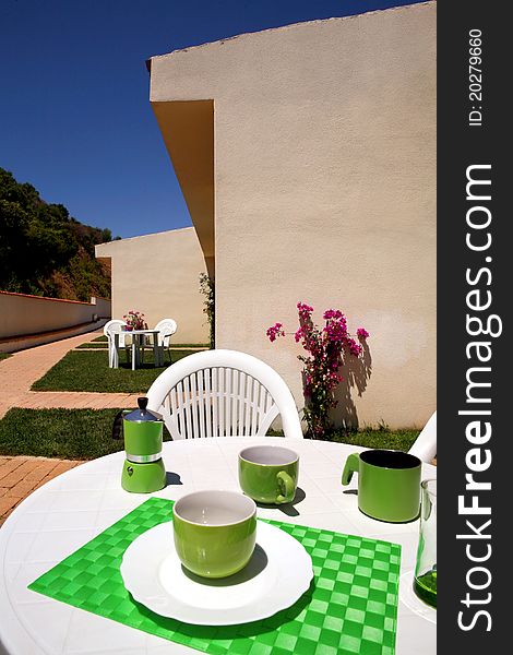 White table with coloured breakfast items. White table with coloured breakfast items