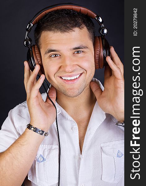 Handsome Man Enjoying Music On Headphones