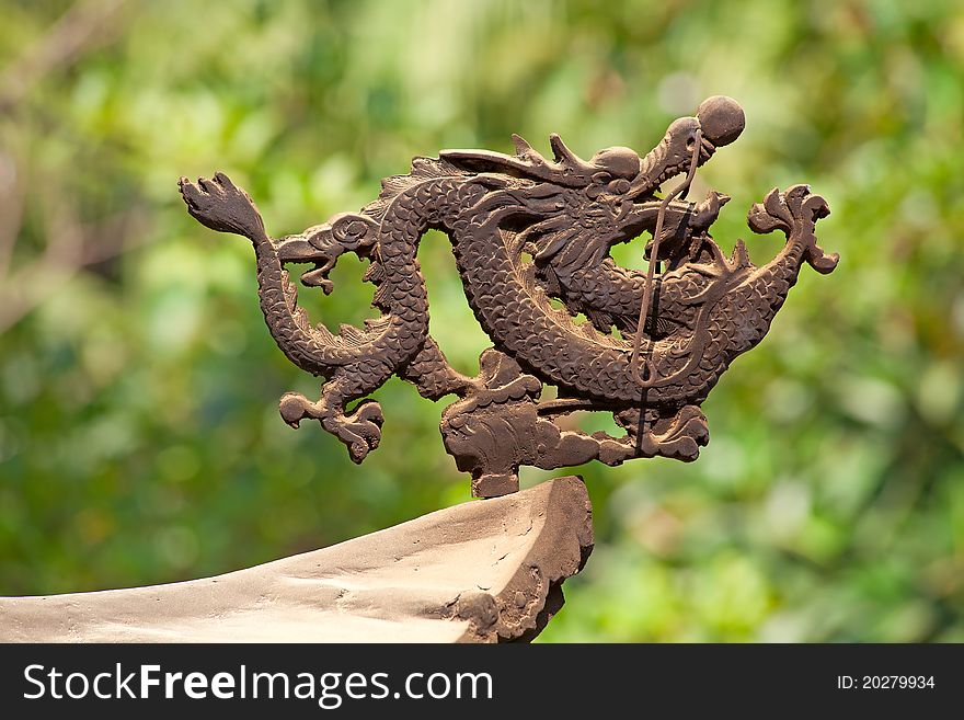 Bronze dragon on the incense pot in Po Lin monastery on Lantau Island (Hong Kong)