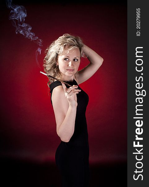 Beautiful woman with cigarette holder